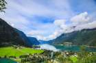 Skjolden, Norway. Aerial view, Fjord, cruise ship, Norwegian village and red barns. Art Print